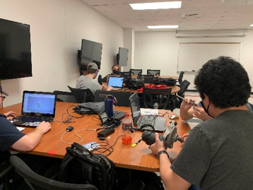 Engineering students working together on a practical project.